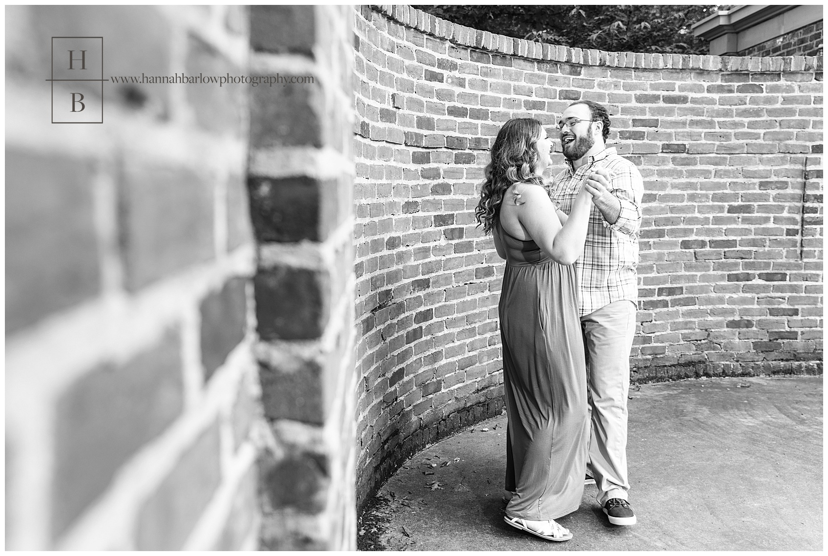 Black and White Photo of Couple Dancing in Front of Oglebay Brick