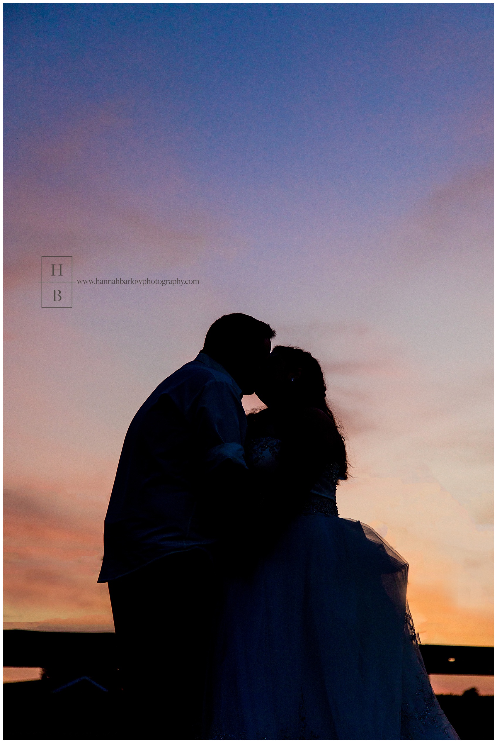 Bride and Groom Kissing at Sunset