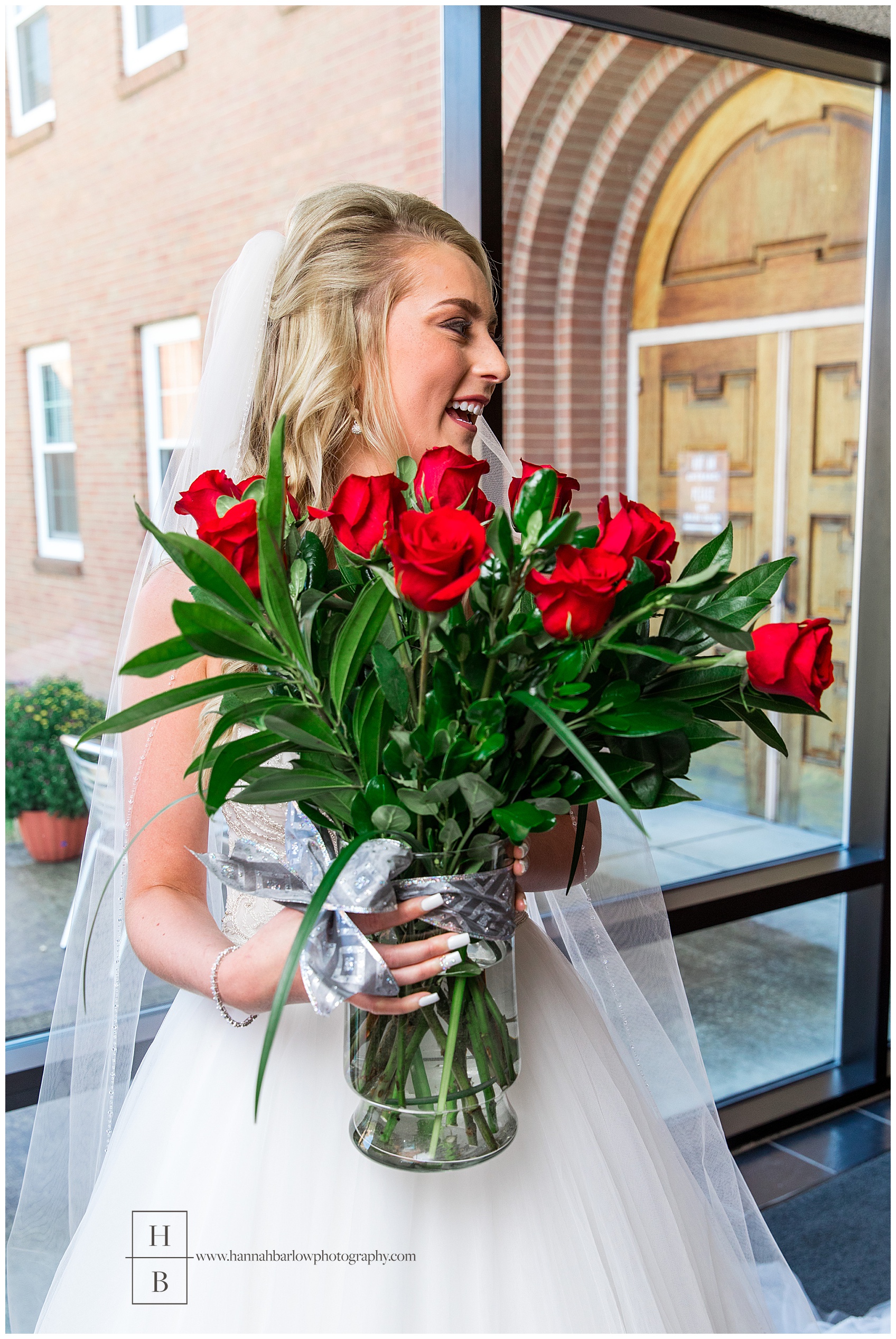 Bride Holding Roses at St. Vincent de Paul Church Wheeling