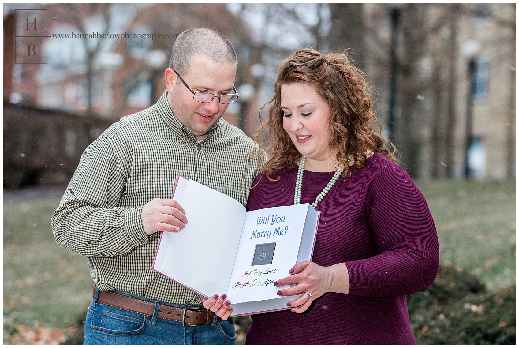 Engagement Session Photo With Couple Holding Book