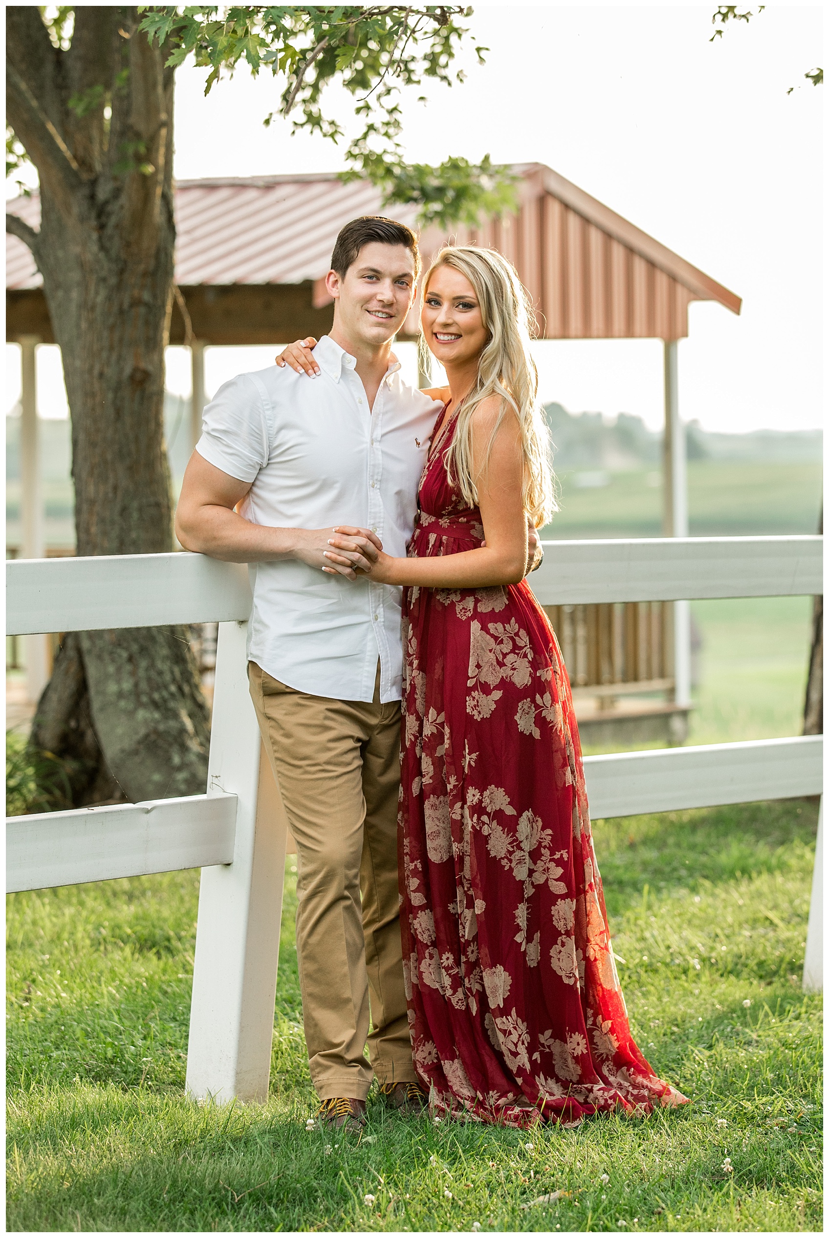 Couple By Fence for Engagement Photos