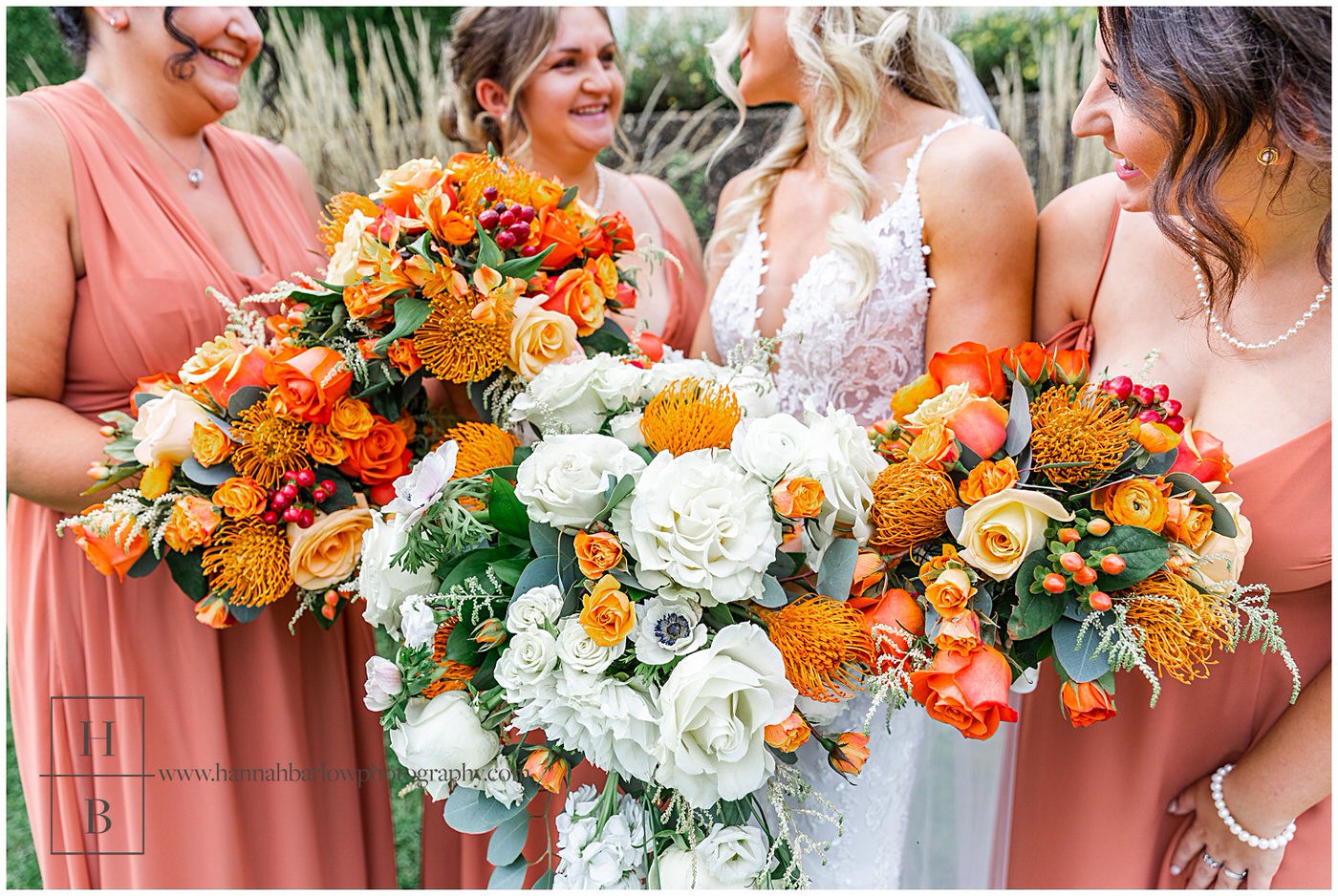 Bride and Bridesmaids Holding White and Orange Bouquets 