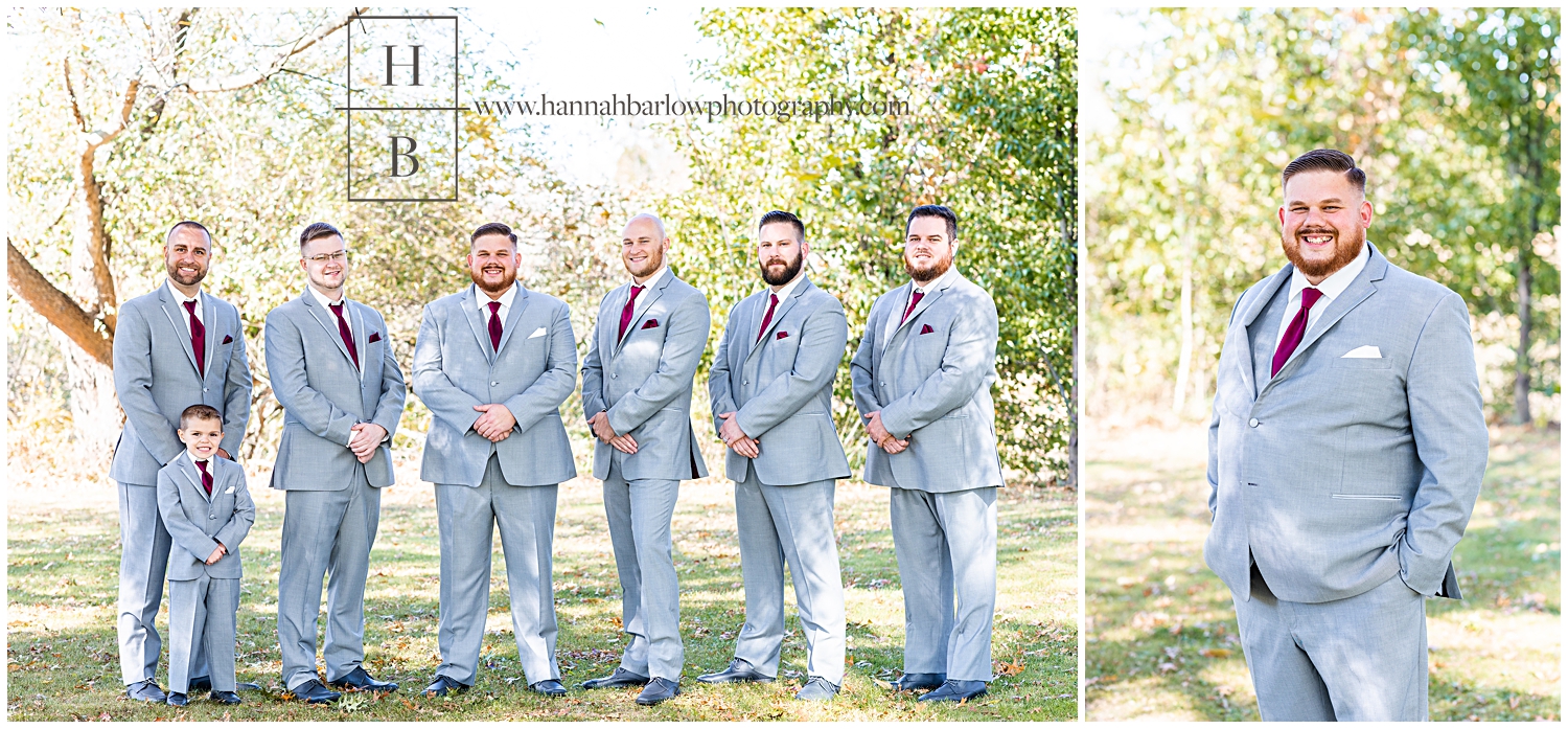 Groom and Groomsmen in Grey Tuxes Pose for Photos