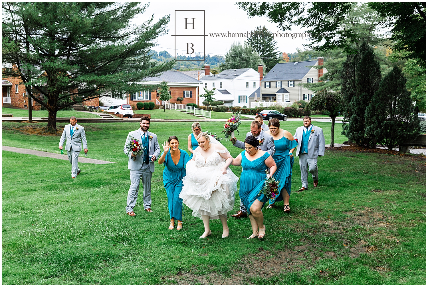 Bride Holding Up Dress Walking through wet grass with bridal party