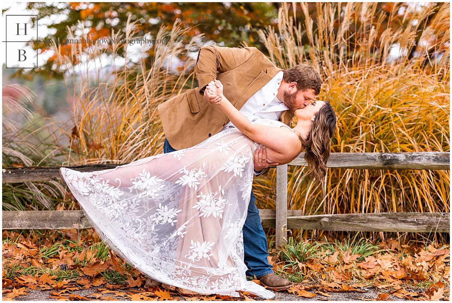 Man dips woman in white lace dress during fall