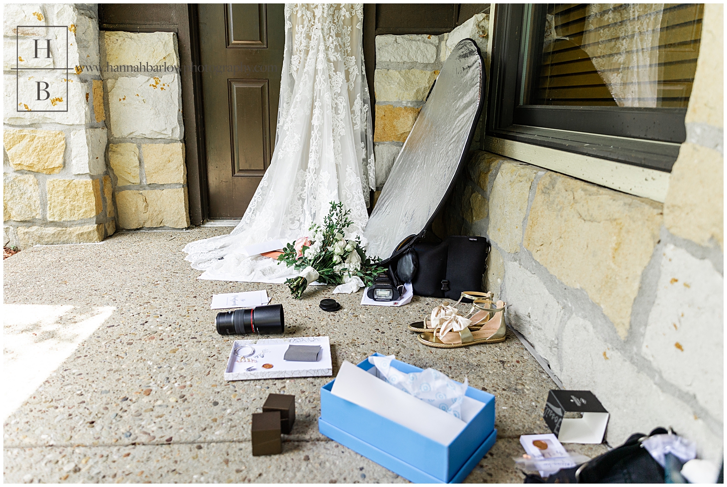 Photo of wedding photographer details laying on ground ready to be photographed