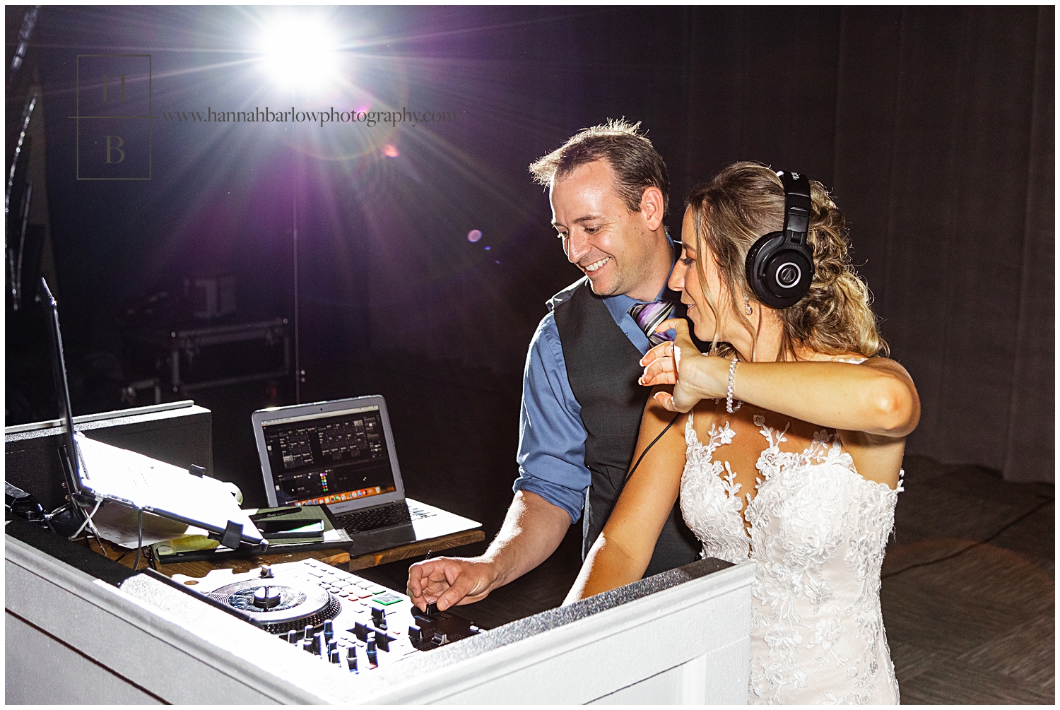 Wedding DJ has bride act as DJ wearing headphones and scratching