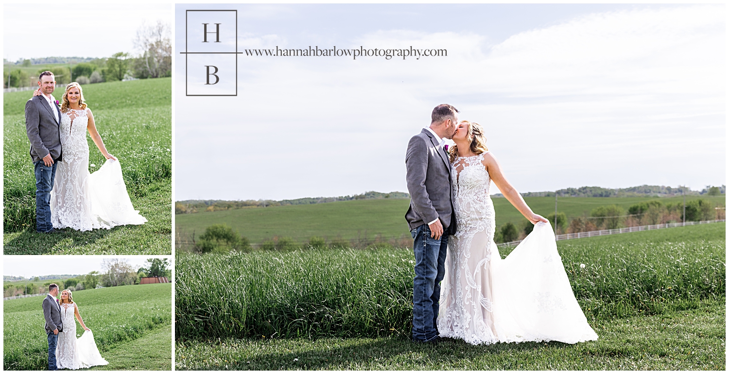 Bride and groom pose on grass line in field for wedding photos.
