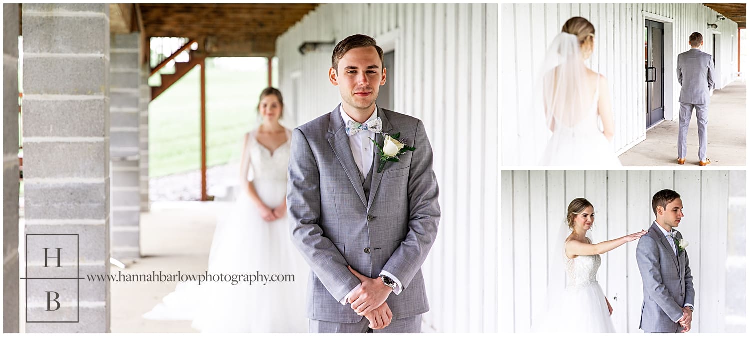 Groom faces camera under white barn in prospect pa as bride approaches from behind