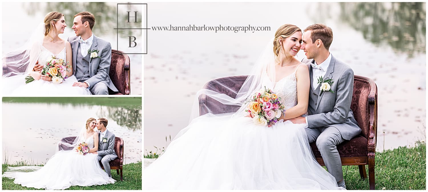 Bride and groom sit in chair by lake for wedding photos