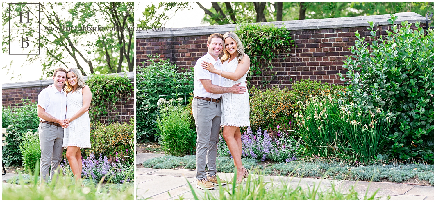 Couple embraces by purple lavender flower bed for engagement phtoos.