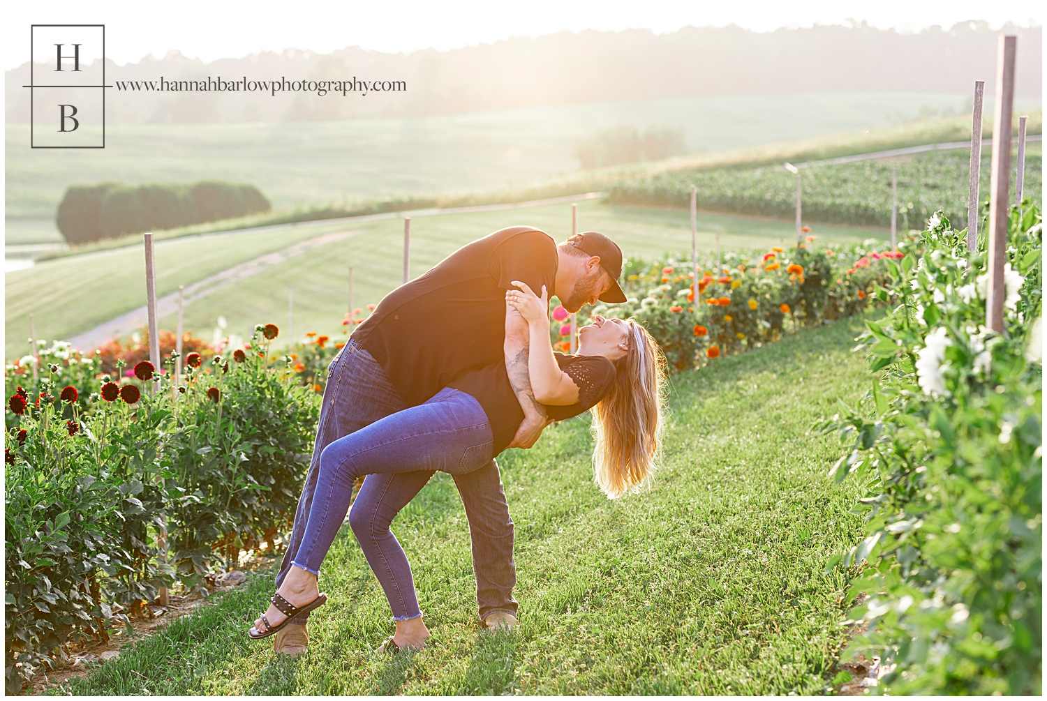 Man dips fiance in flower field.