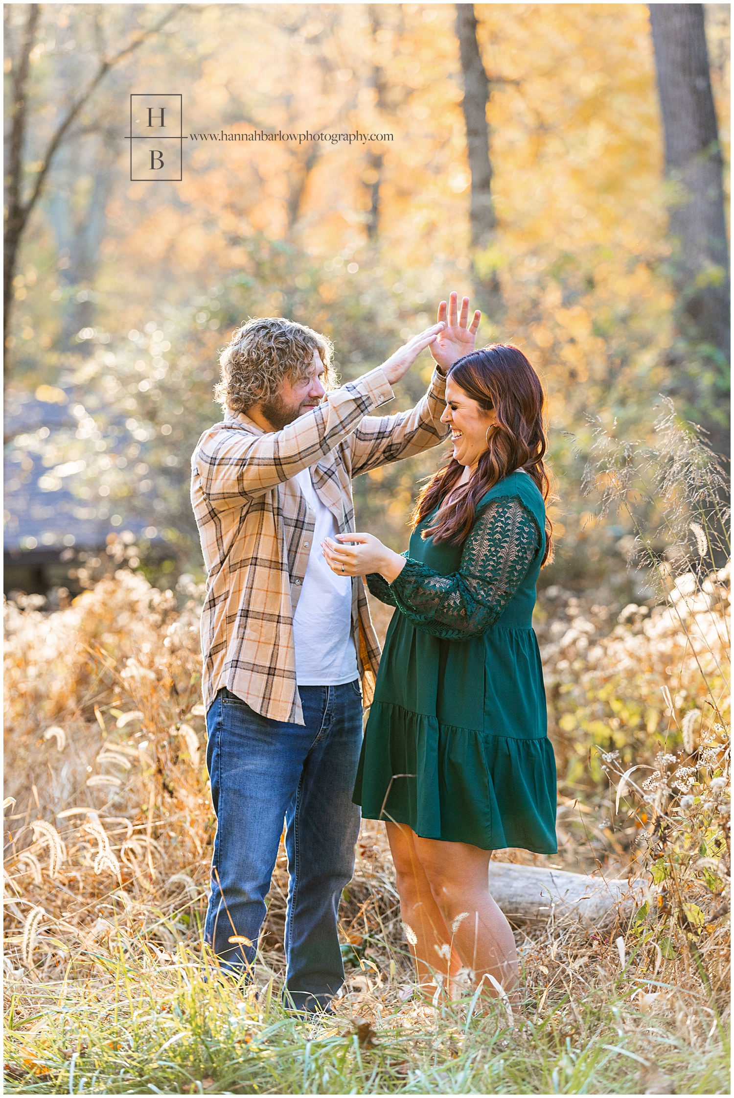 Man and woman laugh in outtake photo for engagement photos.
