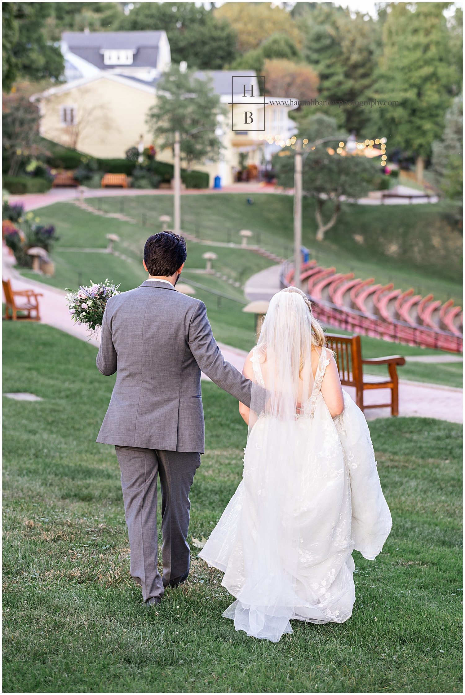 Wedding couple walks away from photographer after photos.