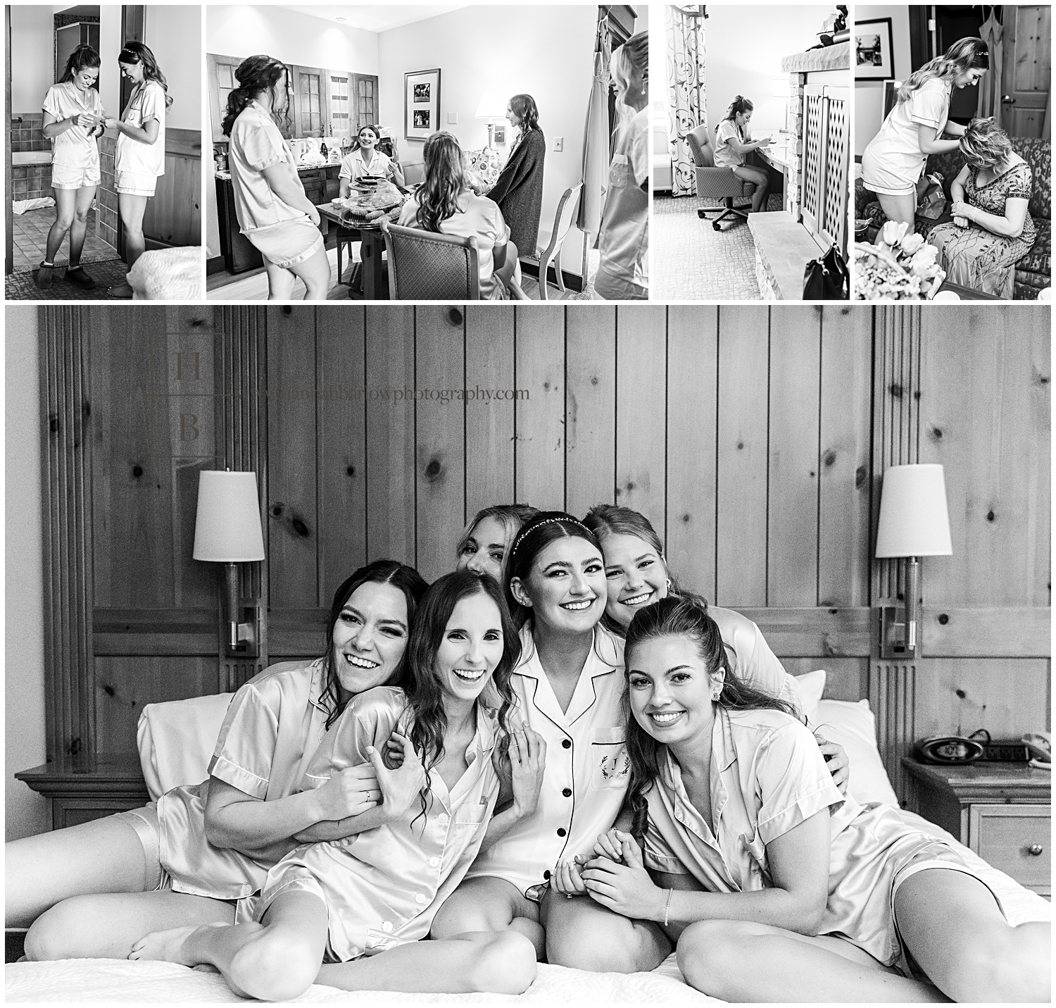 Black and white photo of bride and bridesmaids hugging on bed in silk robes.