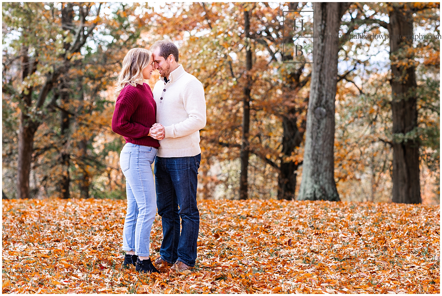 Man and woman embrace forehead to forehead for engagement photos