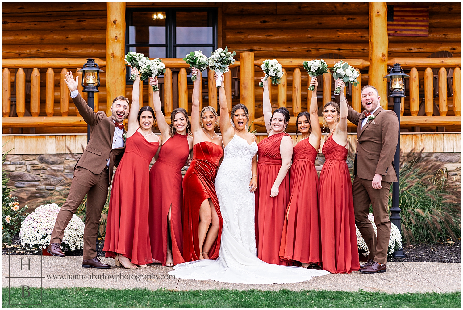 Bridesmaids and two groomsmen cheer with bride