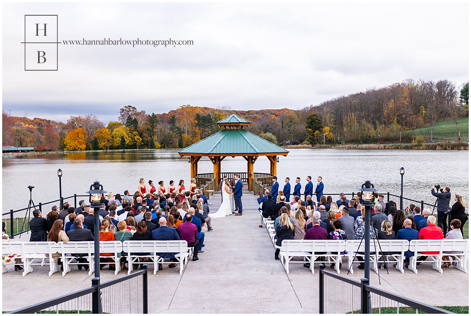 wide angle of wedding ceremony by lake