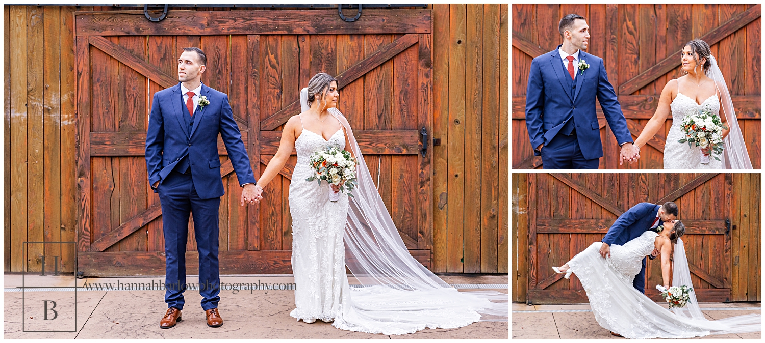 Bride and groom hold hands and pose in front of barn doors