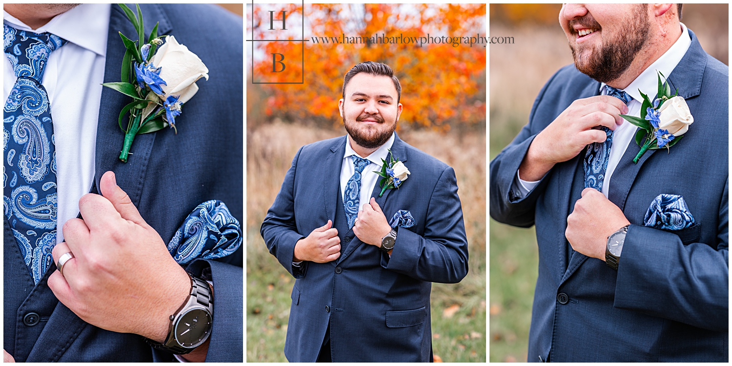 Groom in navy tux holds lapels and shoes off ring.