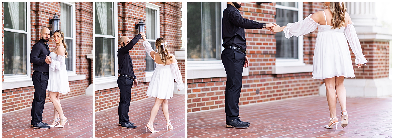 Lady in white dress dances with fiance in black suit on bride porch.