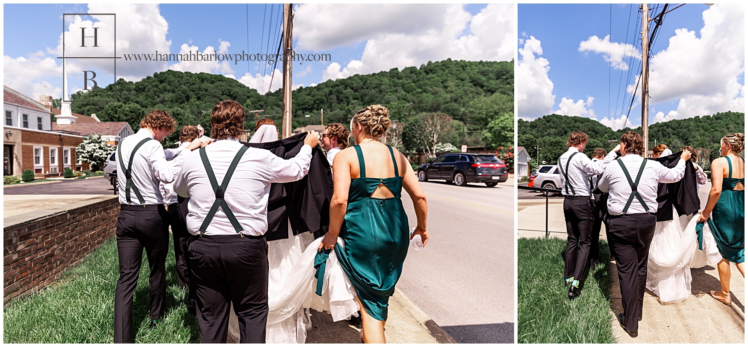 Groomsmen hold up jackets to hide bride from guests