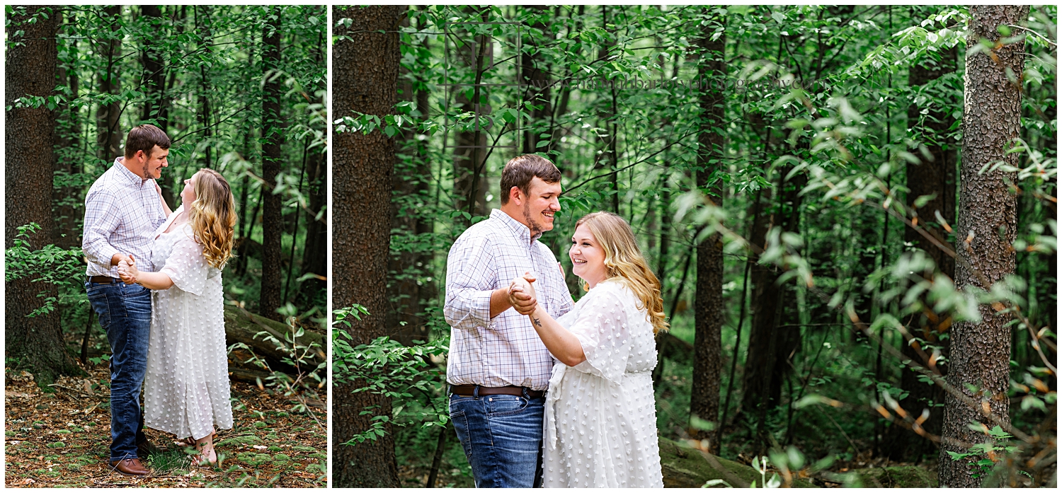 Couple dances in forest for engagement photos