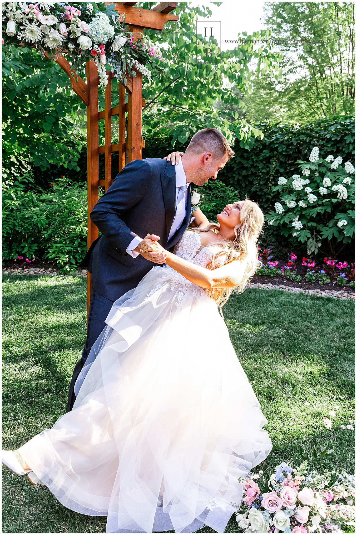 Groom dips bride