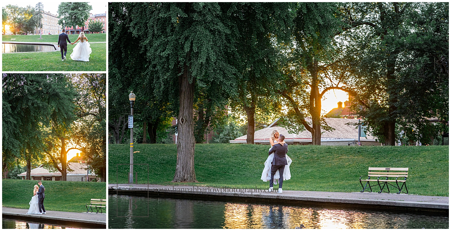 Groom spins bride around by lake during golden hour