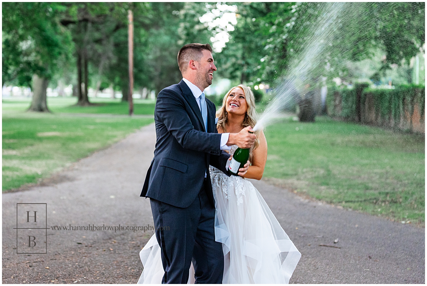 Groom sprays champagne in celebration