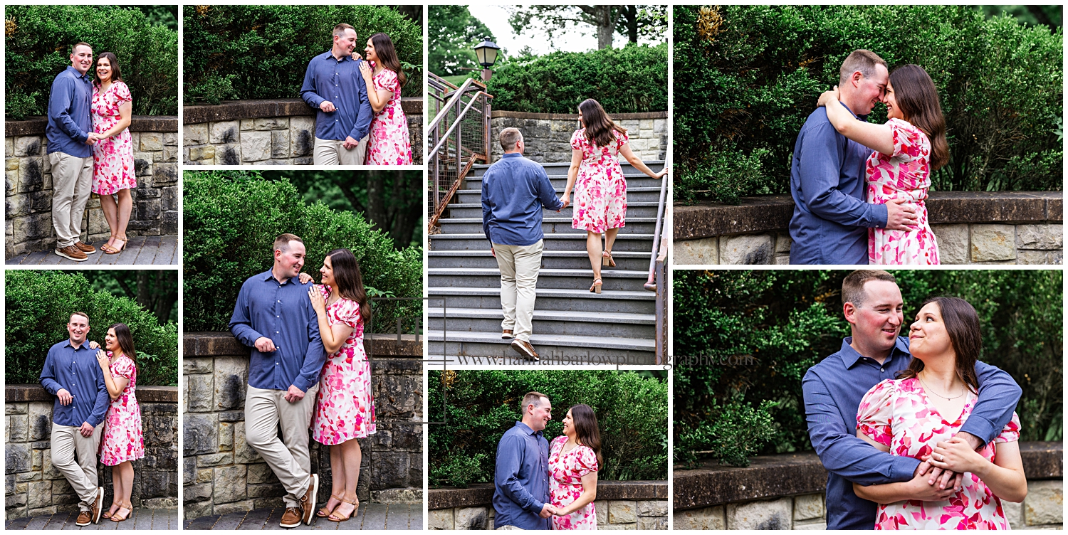 Man and woman pose by stone wall and green bushes