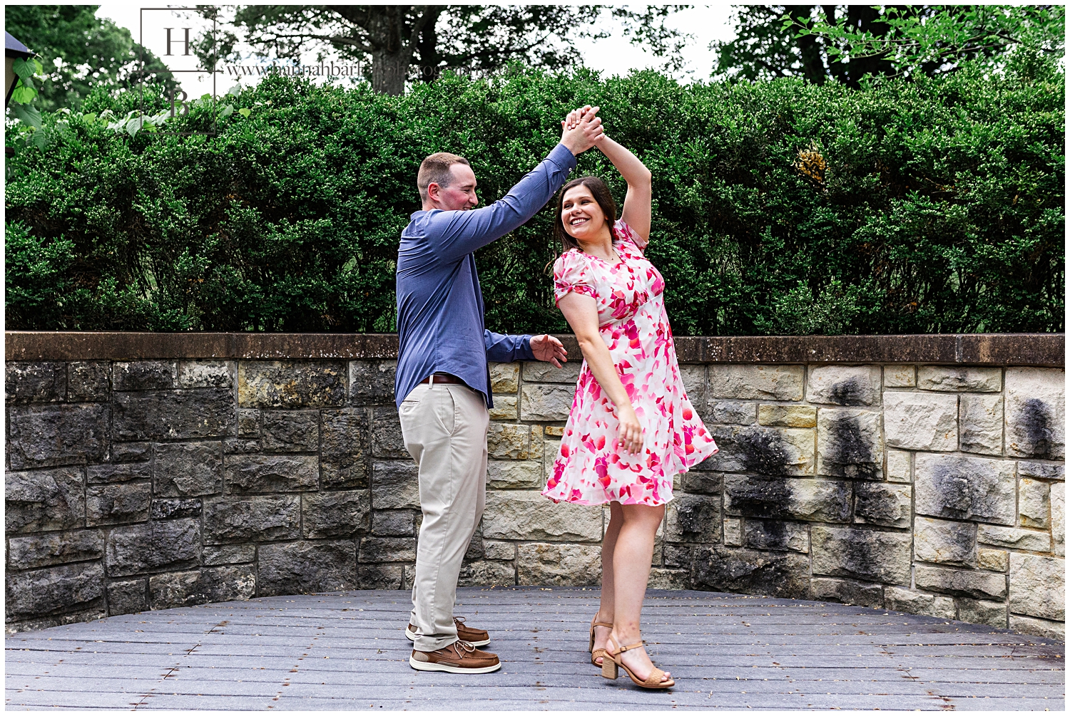 Man spins fiancee wearing pink dress