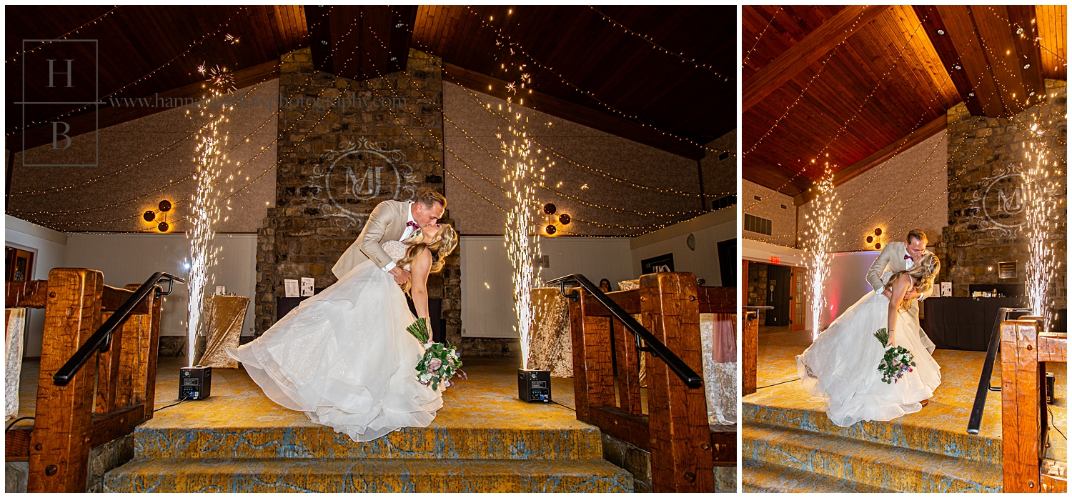 Bride and groom dip between sparklers