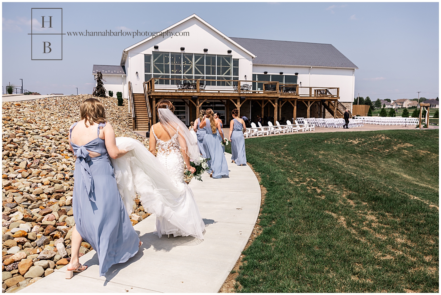 Bride and bridesmaids walk back to venue