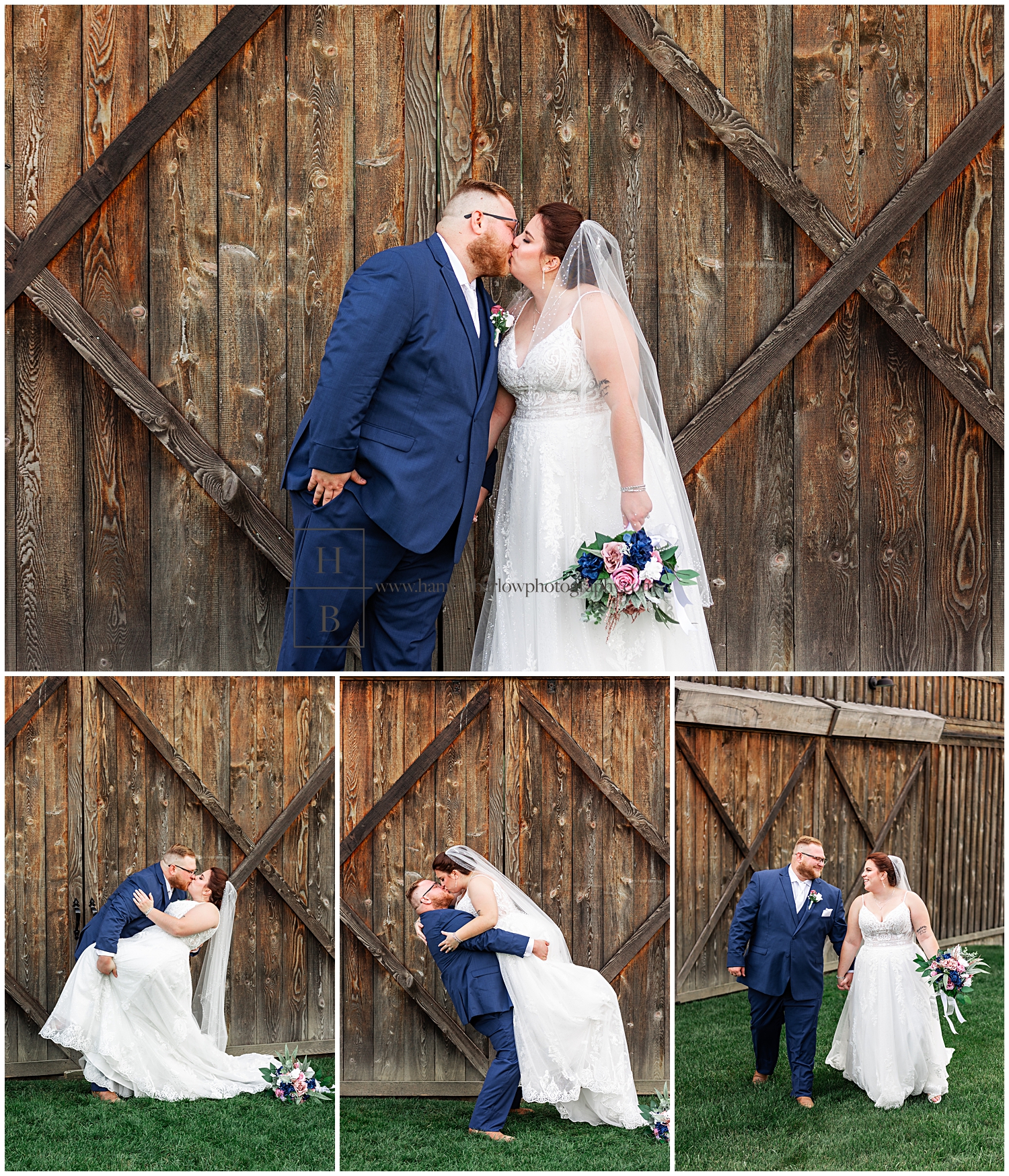 Groom in navy tux poses with bride in front of barn