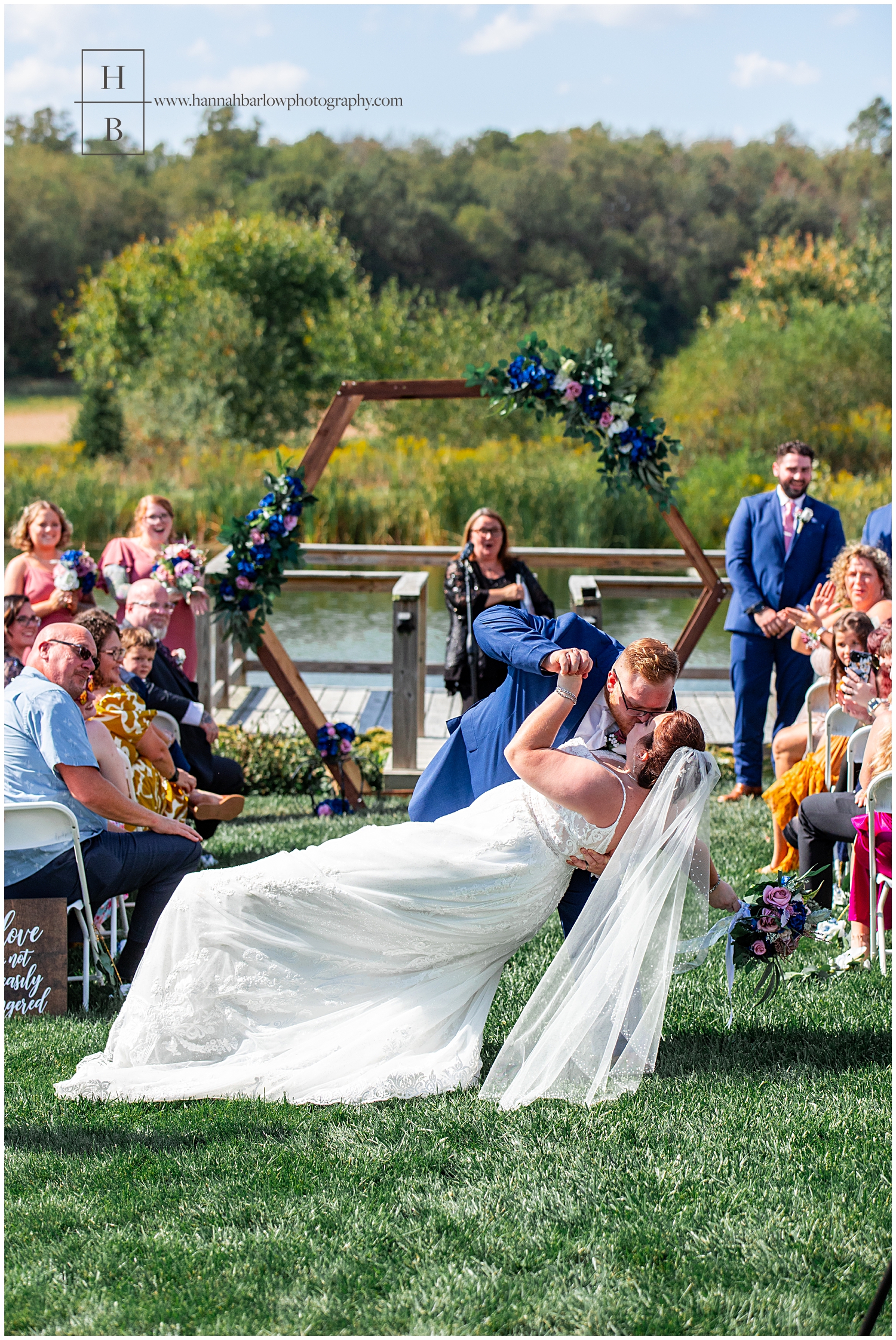 Groom dips bride after ceremony