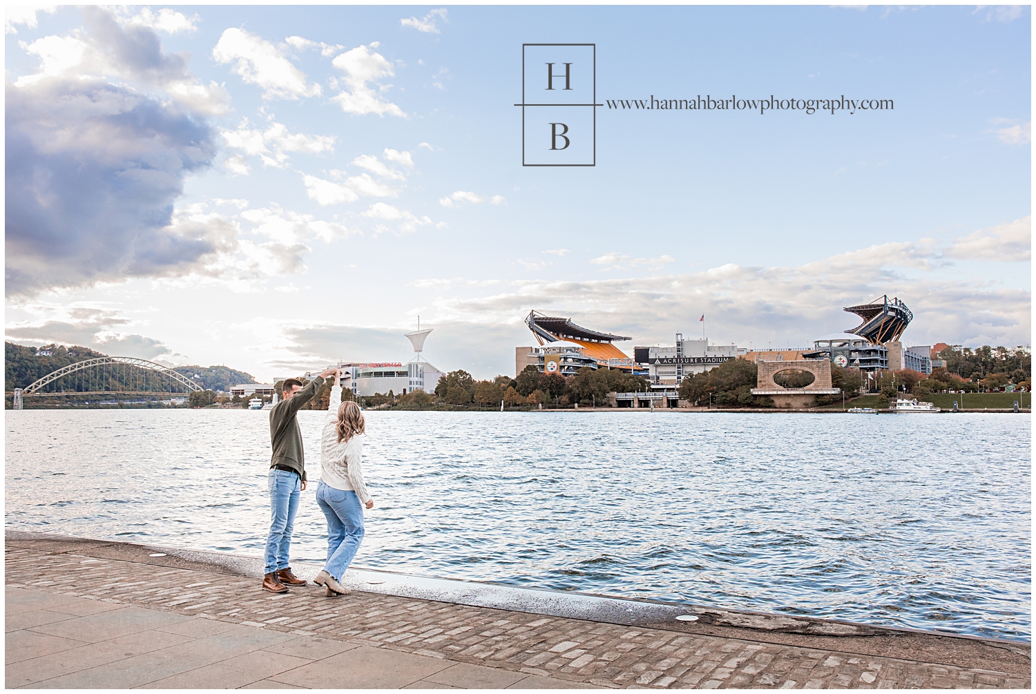 Couple dances in front of Pittsburgh football stadium