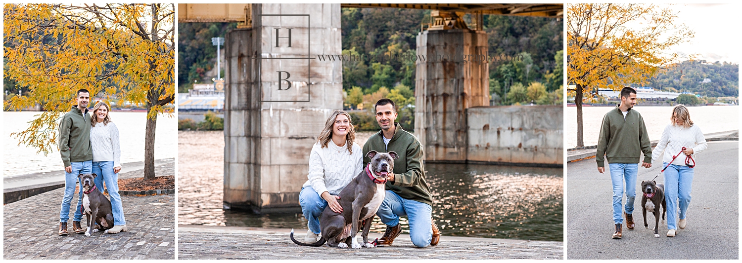 Couple poses with dog by river for engagement photos