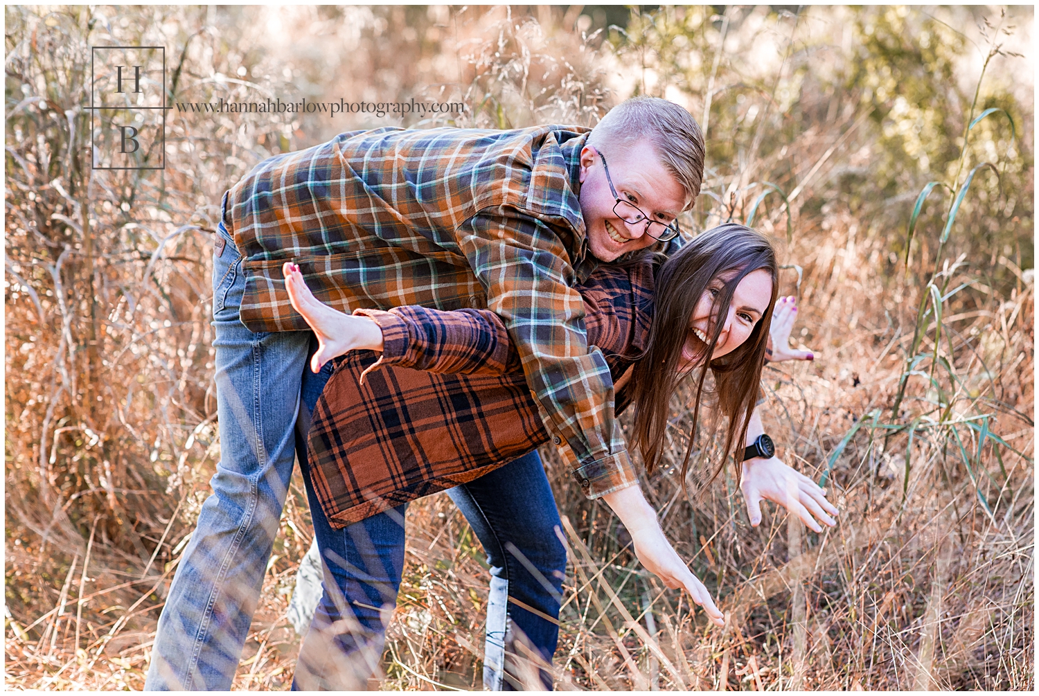 Girl holds fiancé on back wearing plaid