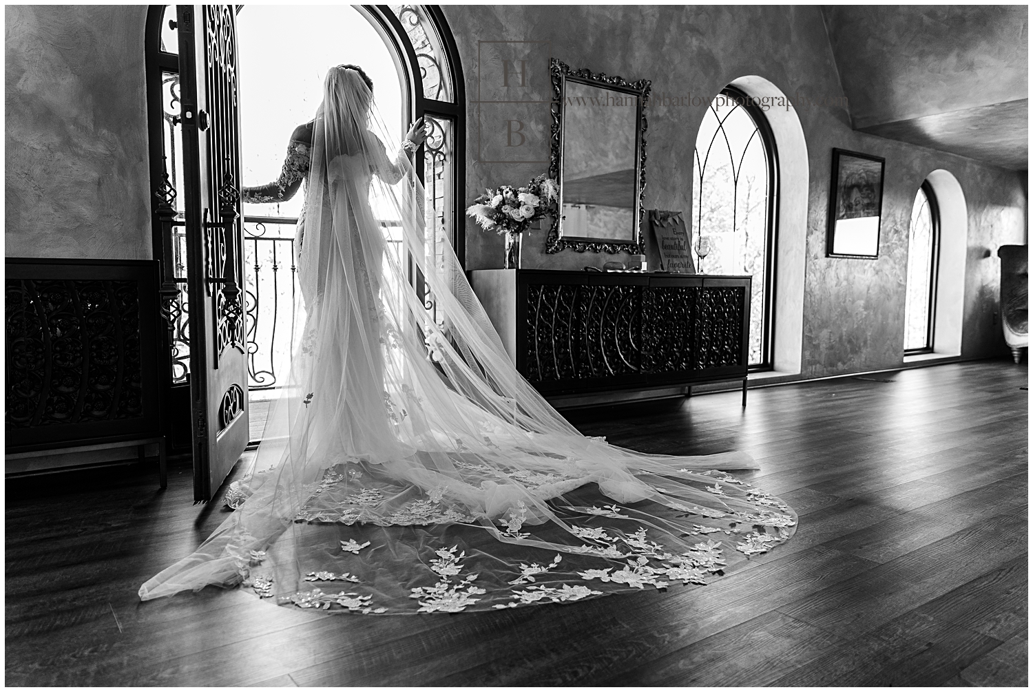 Black and white photos of bride looking out door