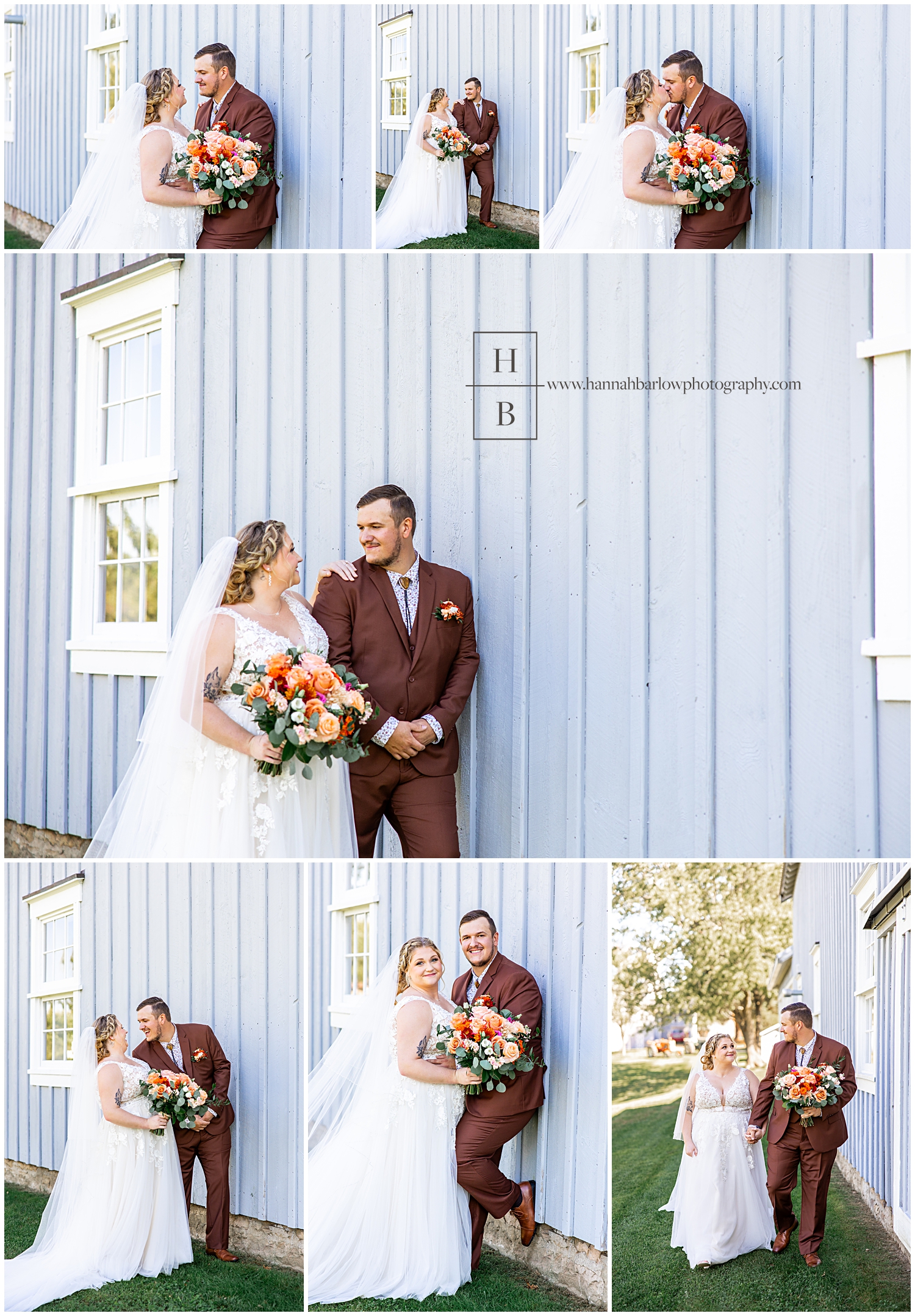 Groom in brown tux poses by blue barn with bride