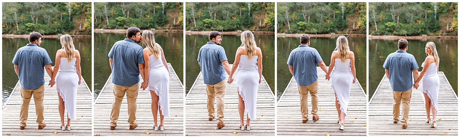 Man and woman walk down the dock for photos