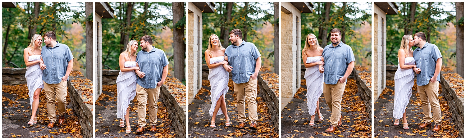 Man and woman walk and fall leaves for engagement photos