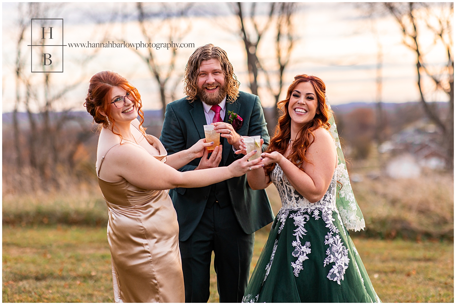 Bridesmaid and champagne dress gives drinks to Bride and groom