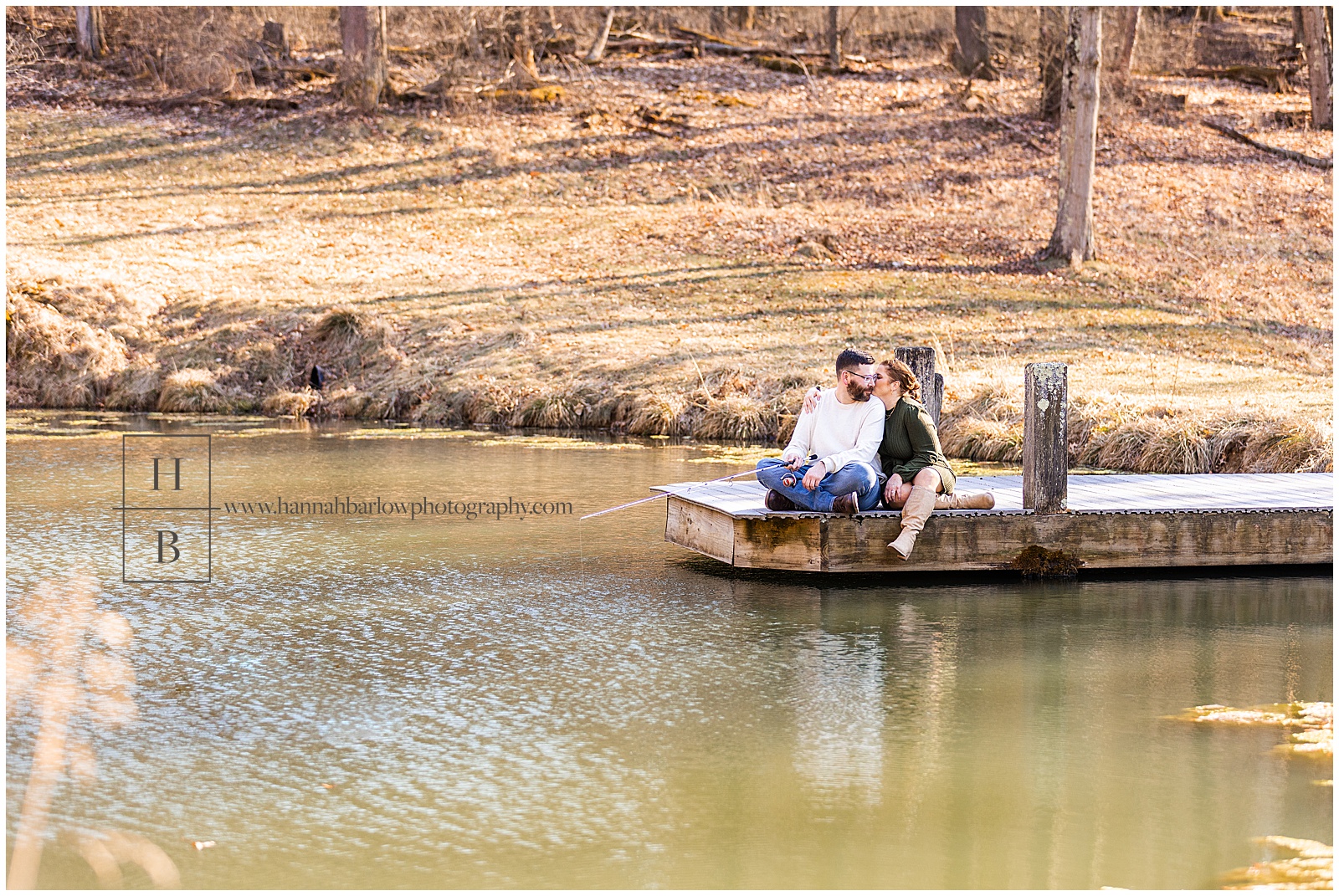 Couple sits on dock while fishing