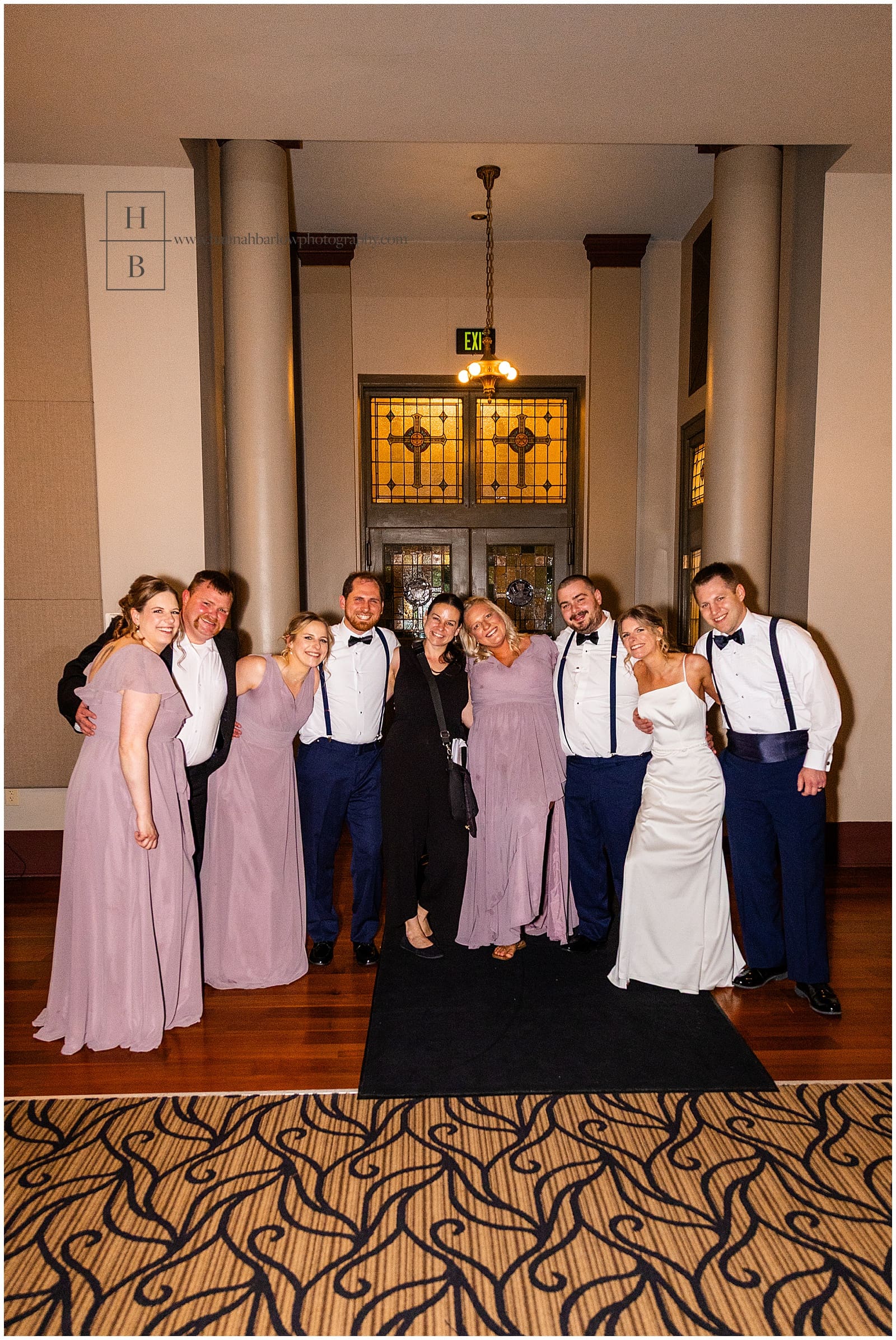 wedding photographer takes photos with couples