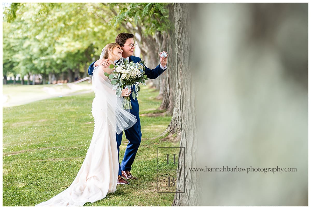 wedding couple smiles and shows off rings to passerby's