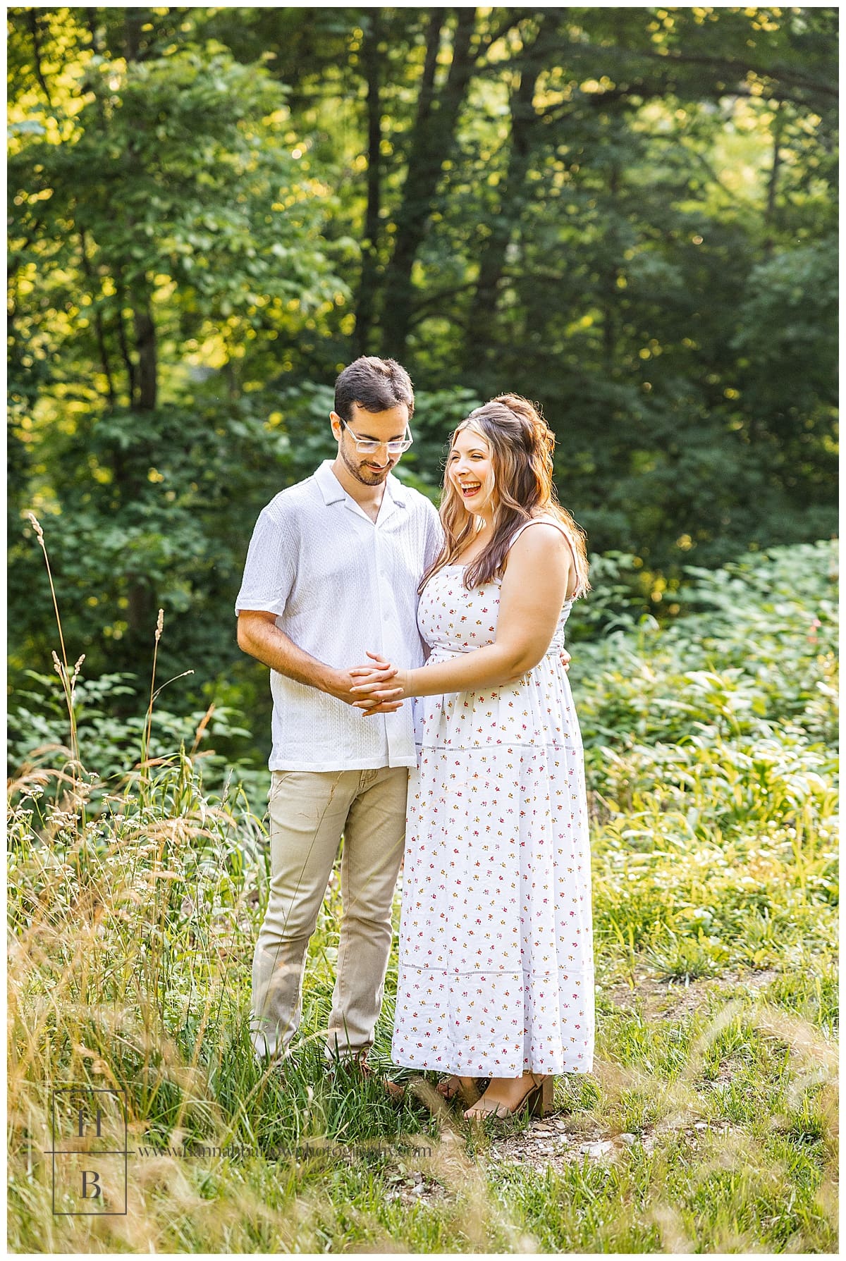 future bride laughs with fiancé for engagement photos