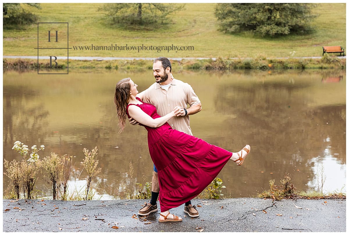groom to be dips bride for engagement photo