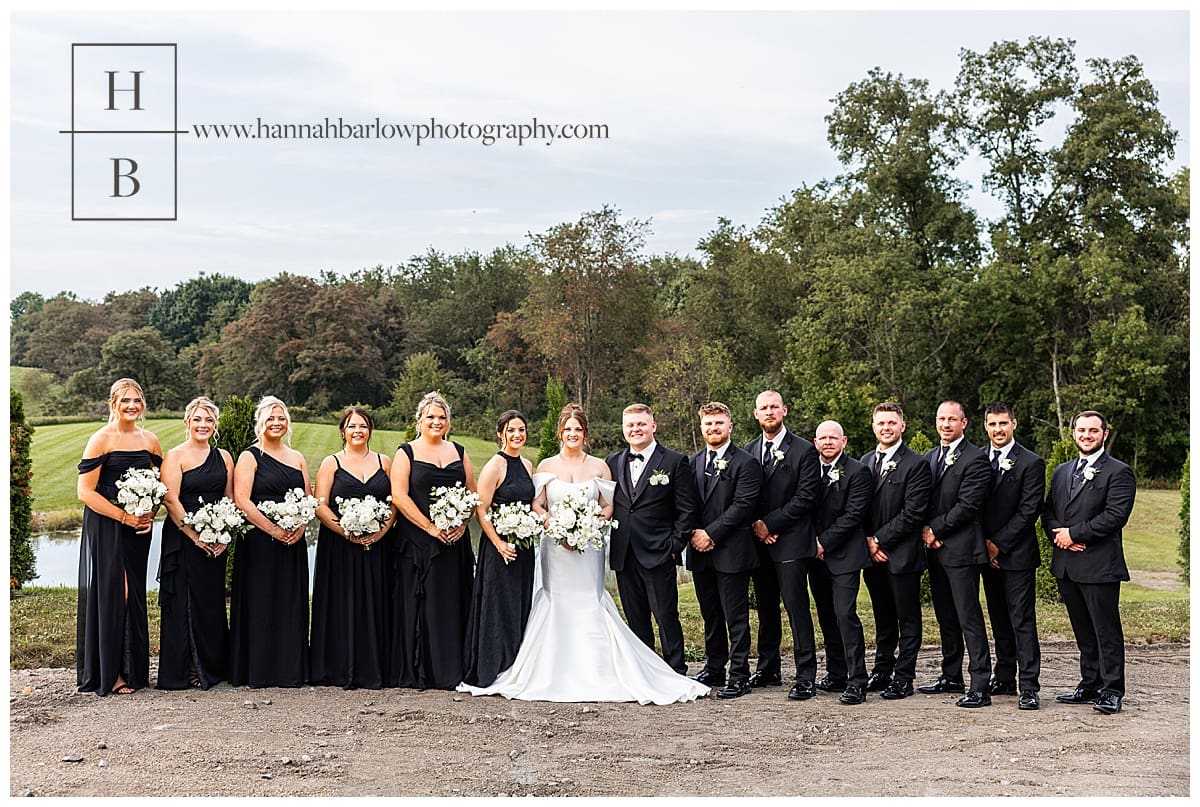 full bridal party in classic black and white pose at crescent acres in st Clairsville Ohio